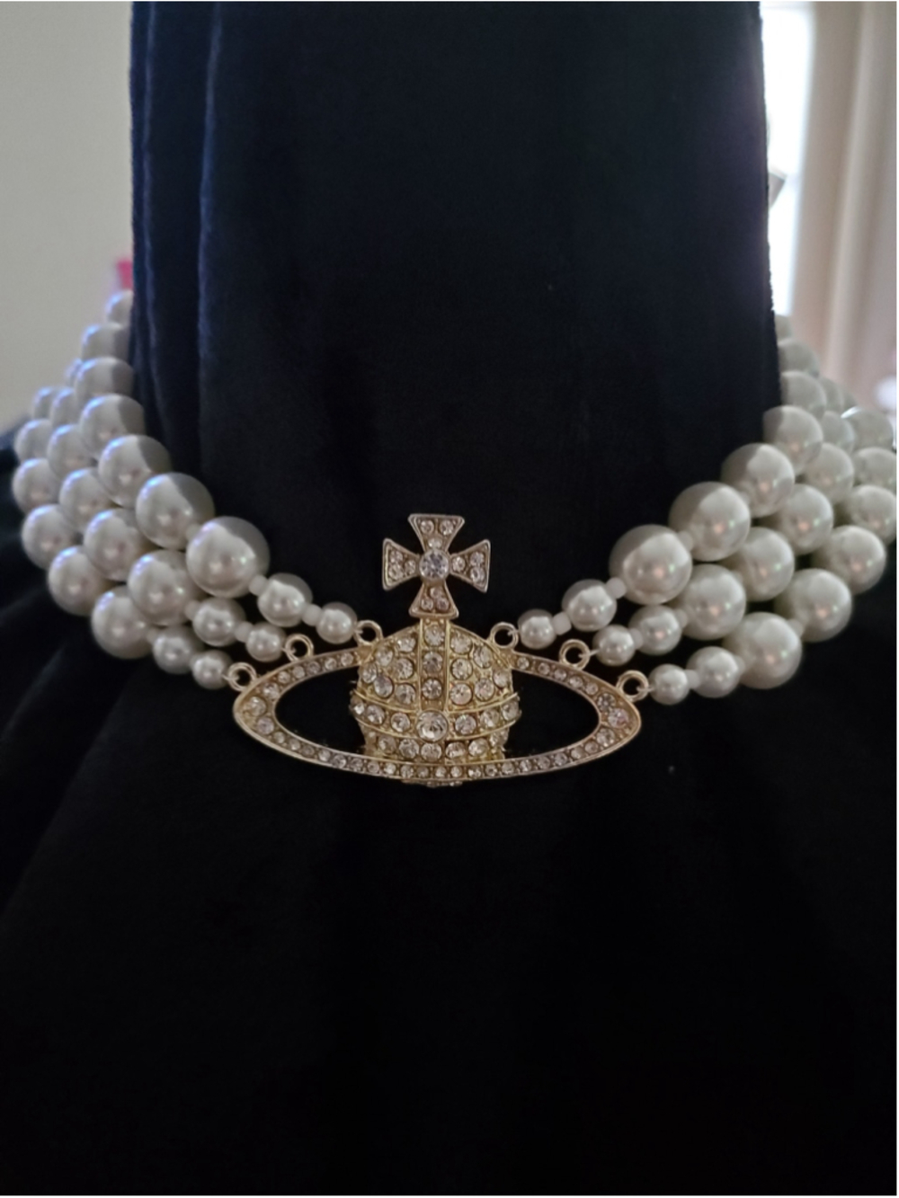 Three-strand Faux pearl necklace with gold center orb pendant,